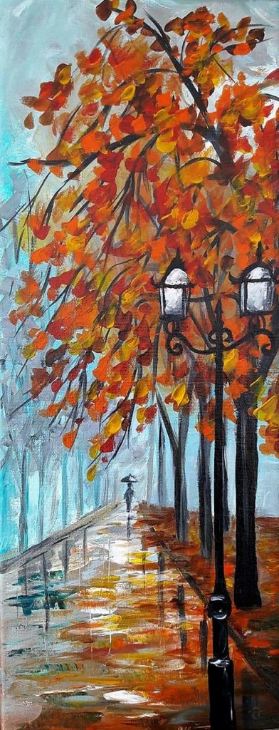 Baumallee im Herbst mit einer Laterne